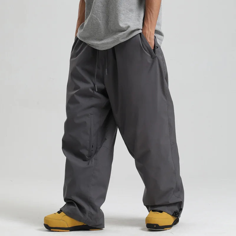 New Baggy Windproof Men Solid Women Skiing Pants Waterproof Loose Hooded Ski Strides Outdoor Sports Adult Breathable Trousers
